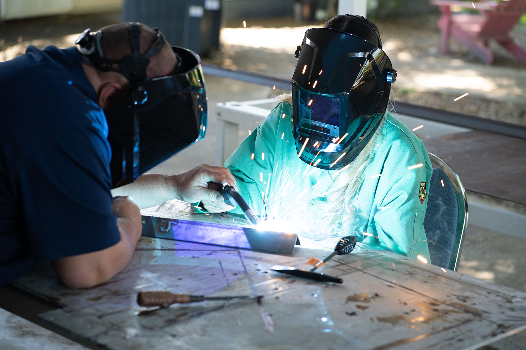 A young woman is introduced to welding at Project LIFT